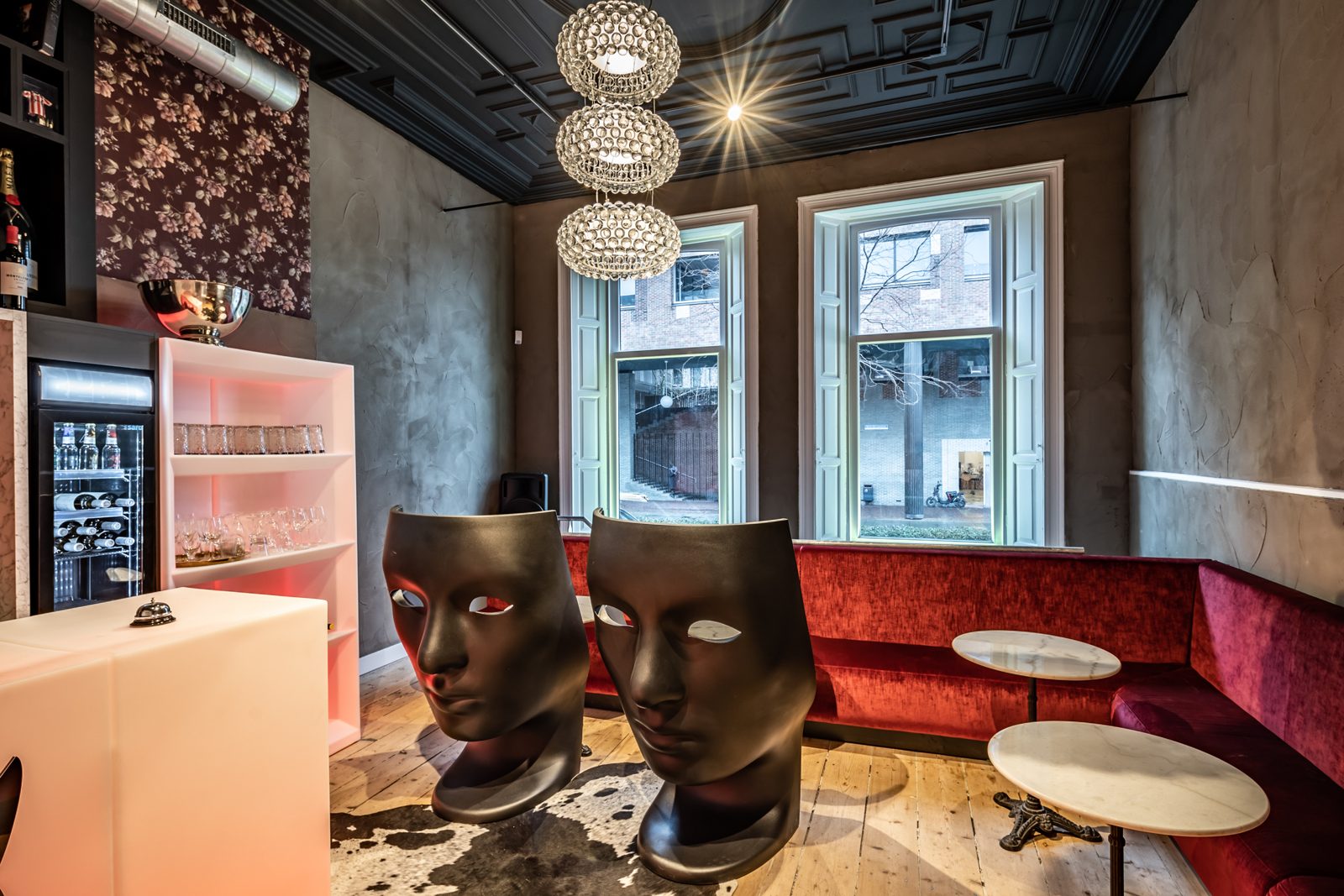 Bronze sculpted heads on the lounge table at Hotel SuperRebel
